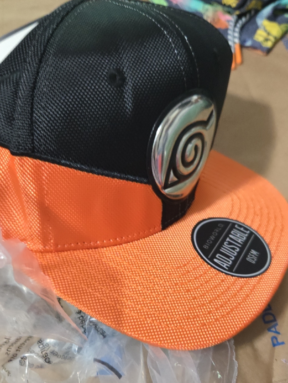 Hot Topic Black and Orange Snapback Hat with Emblem